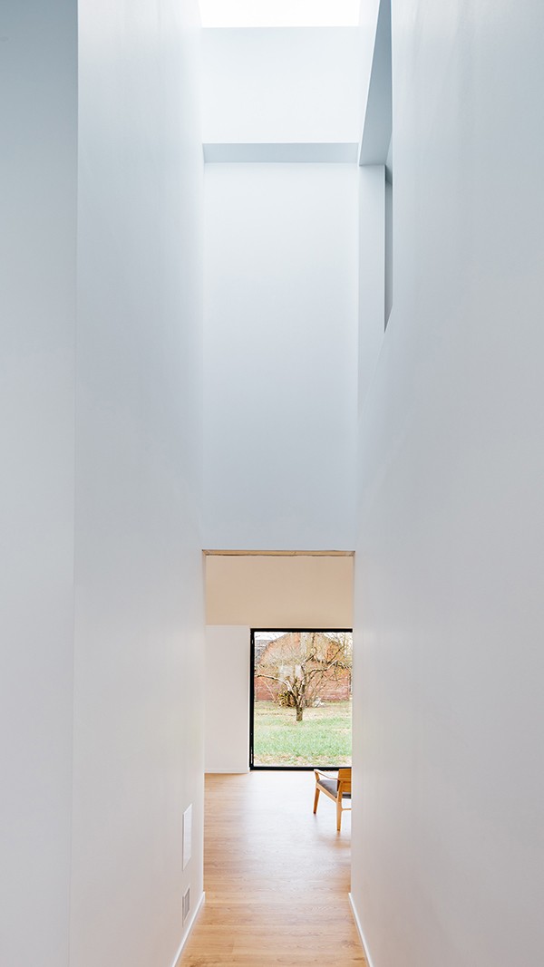 Interior view from a bedroom towards the living room window, upper aperture is visible, studio substrata, Reinis Salins, Igors Malovickis